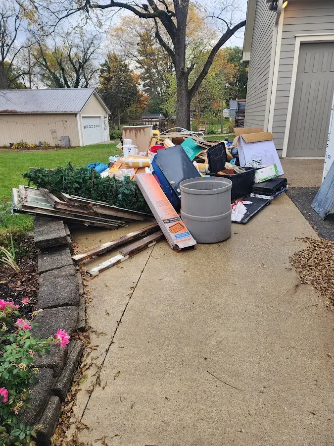 Dumpster being loaded with debris for 3 Yard Dumpster Rental in Dade City